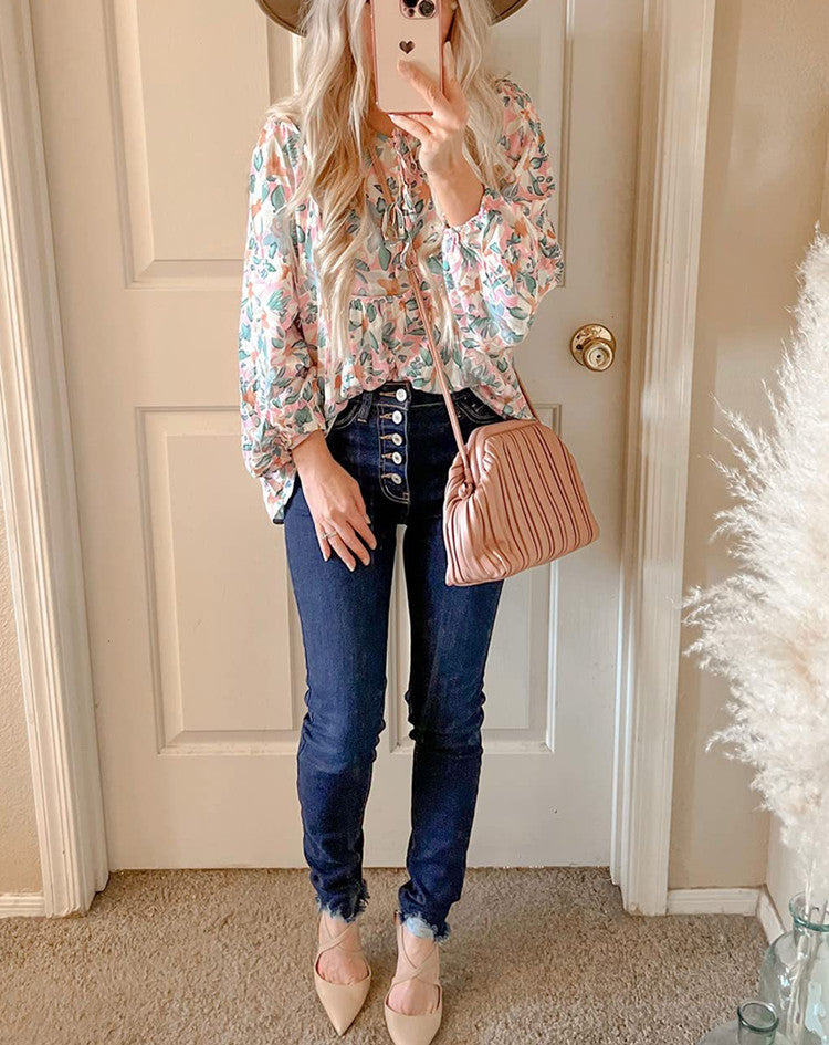 Floral print tie neck blouse with ruffle peplum