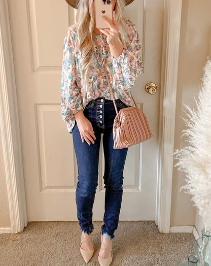 Floral print tie neck blouse with ruffle peplum