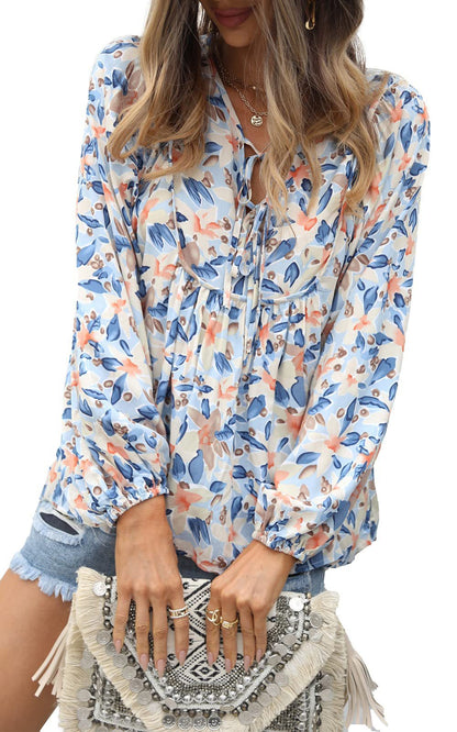 Floral print tie neck blouse with ruffle peplum