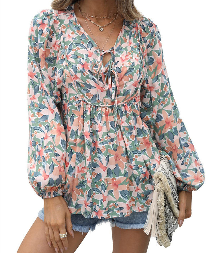 Floral print tie neck blouse with ruffle peplum
