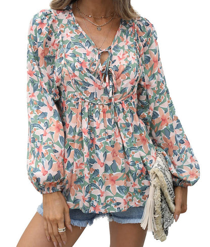 Floral print tie neck blouse with ruffle peplum