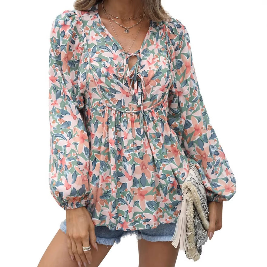 Floral print tie neck blouse with ruffle peplum