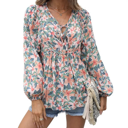 Floral print tie neck blouse with ruffle peplum
