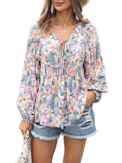 Floral print tie neck blouse with ruffle peplum