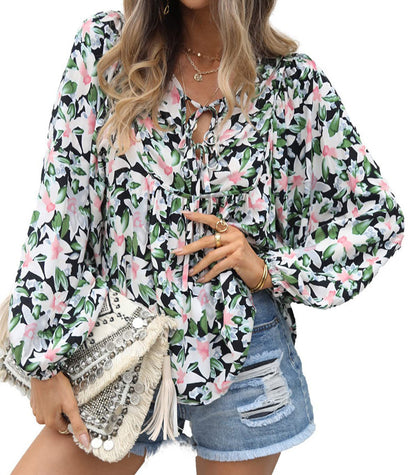 Floral print tie neck blouse with ruffle peplum
