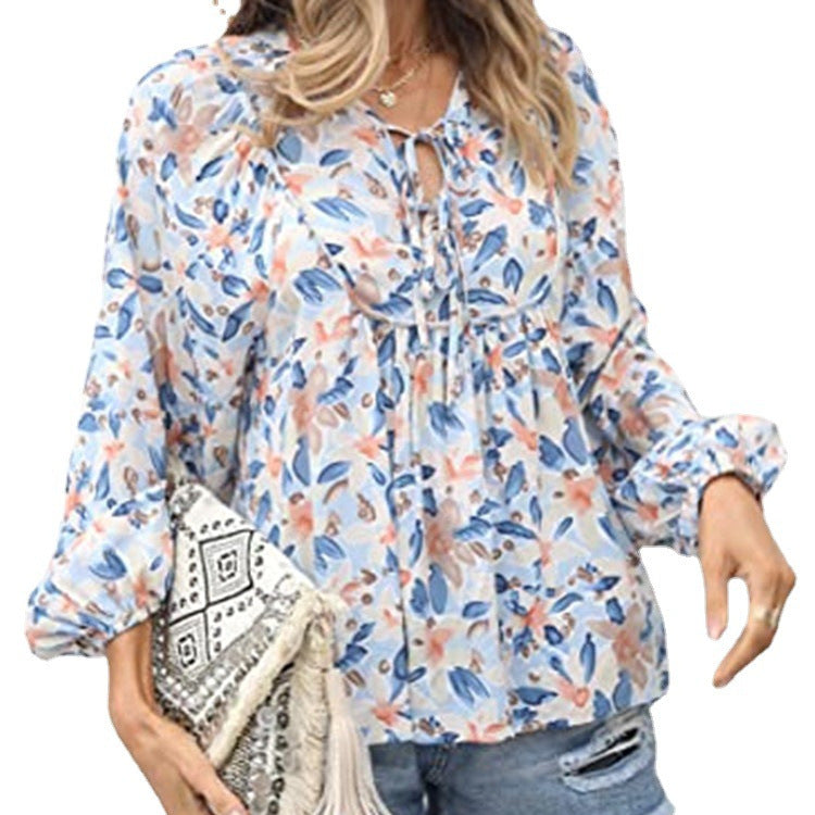Floral print tie neck blouse with ruffle peplum